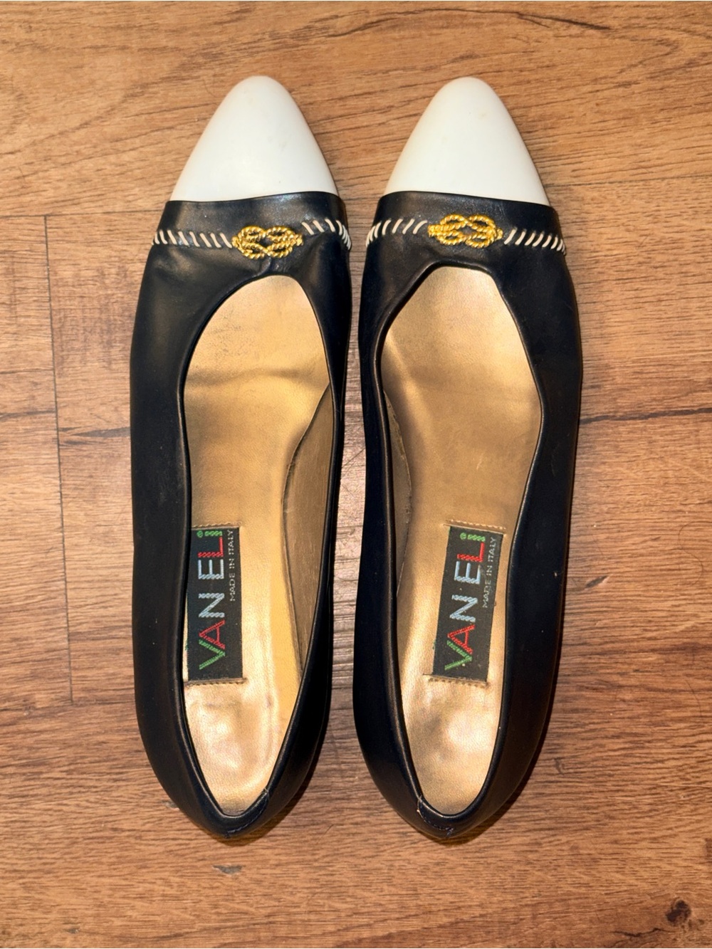 Vaneli Black Flats with White Pointed Cap and Gold Embellishment